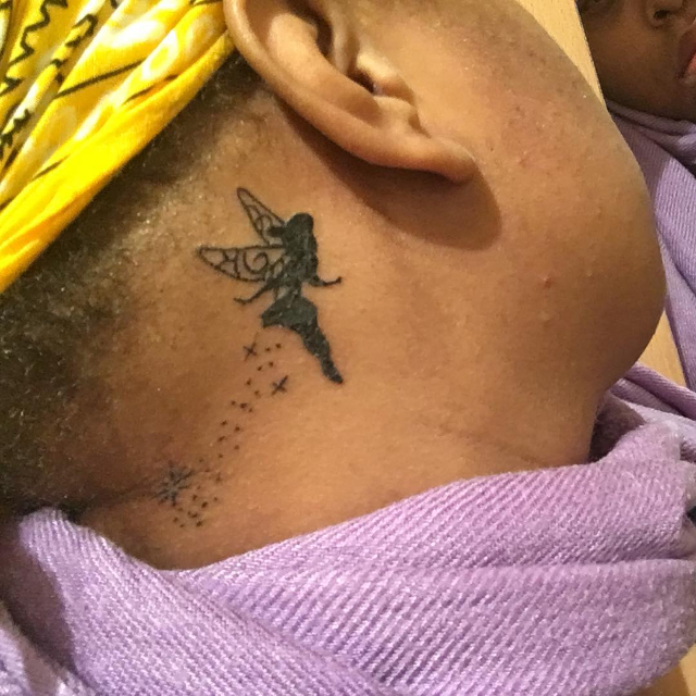 tinkerbell tattoo behind ear