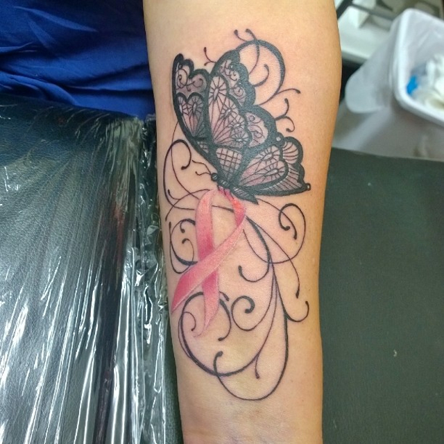 butterfly and swirls tattoo 