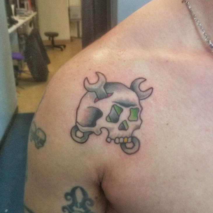 small mechanic tattoo on shoulder
