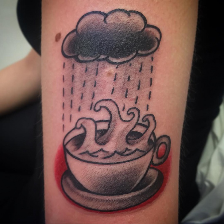 coffee and cloud tattoo on hand