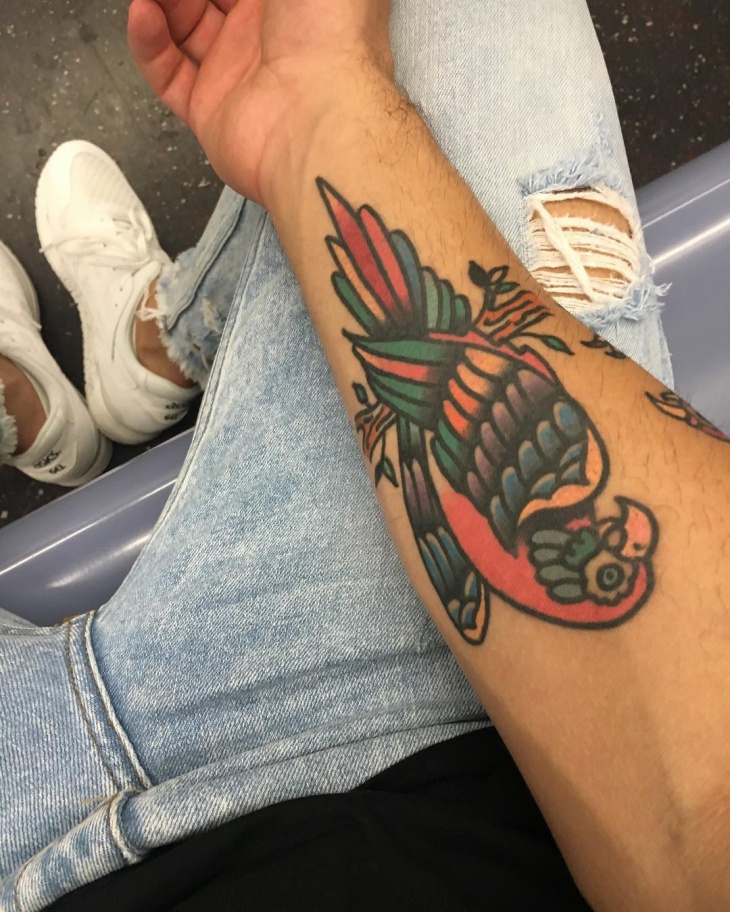 parrot tattoo on wrist