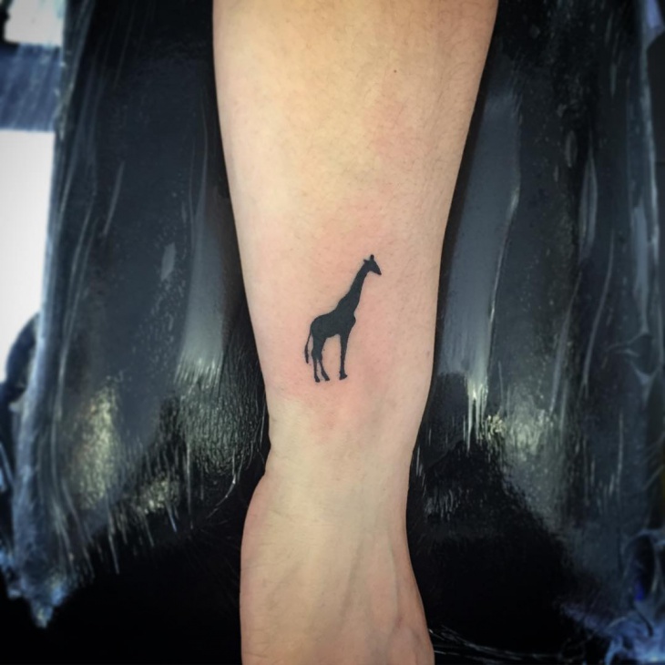 black small giraffi tattoo