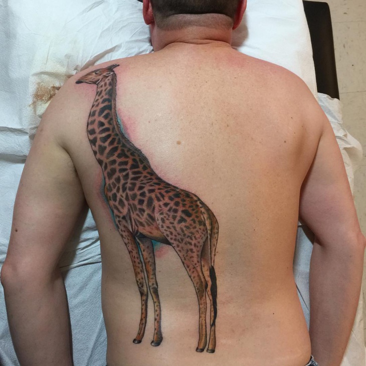 awesome giraffe tattoo for back