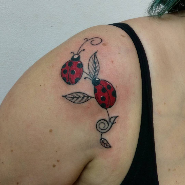 ladybug tattoo on shoulder