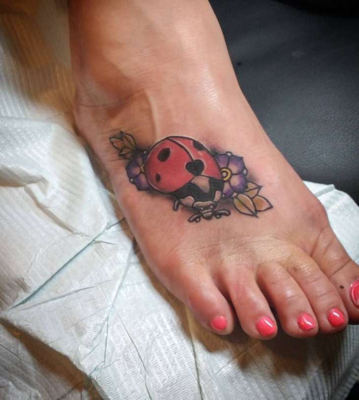 traditional ladybug tattoo on foot