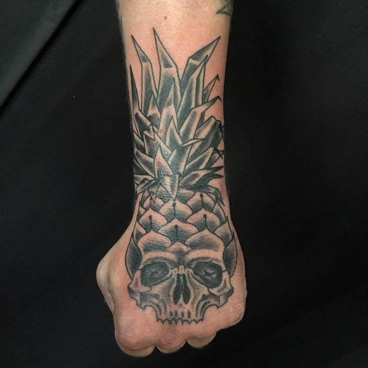 skull pineapple tattoo on palm