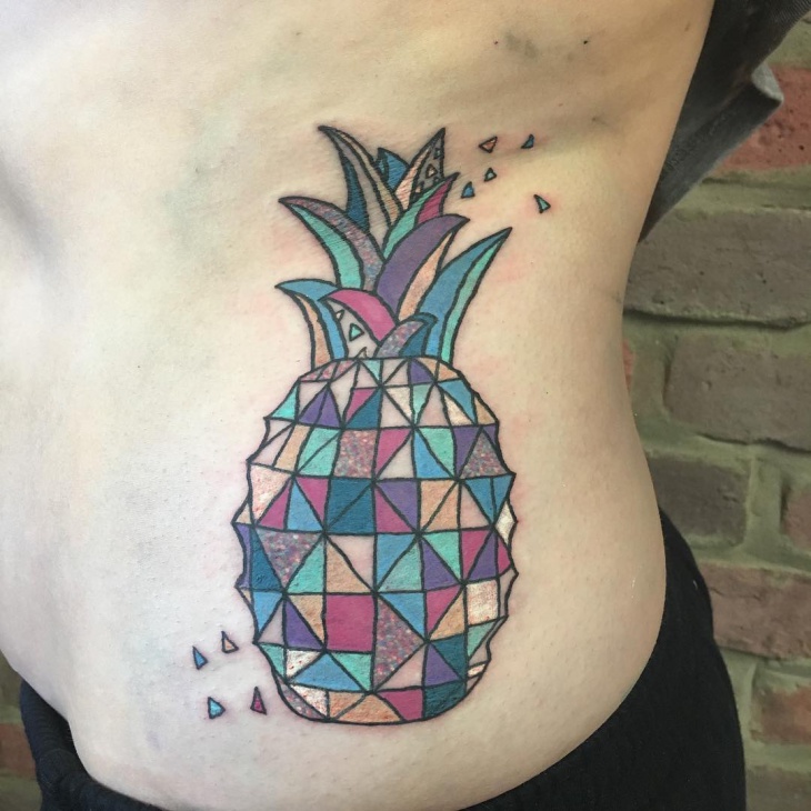 geometric pineapple tattoo on ribs