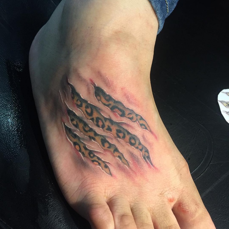 cheetah print foot tattoo