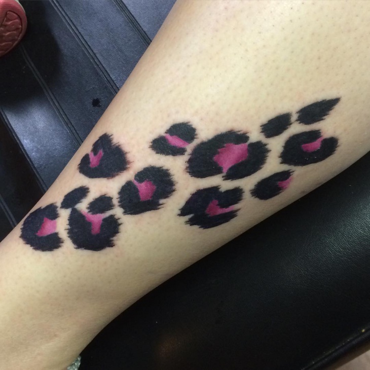 purple and black cheetah print tattoo