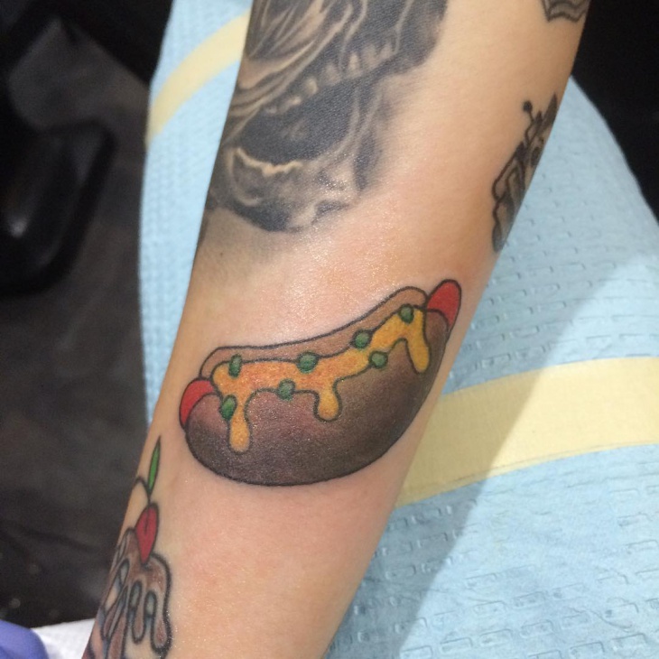 hot dog tattoo on hand