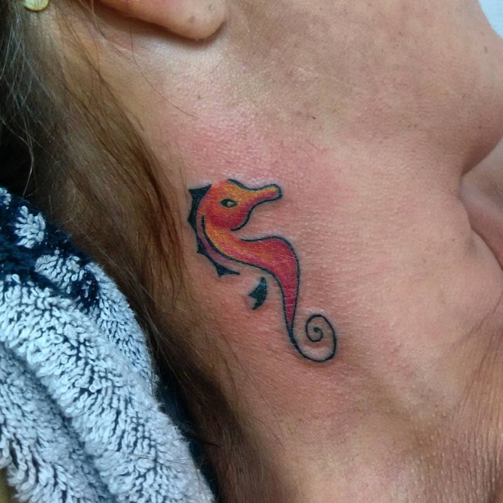 cute seahorse neck tattoo 