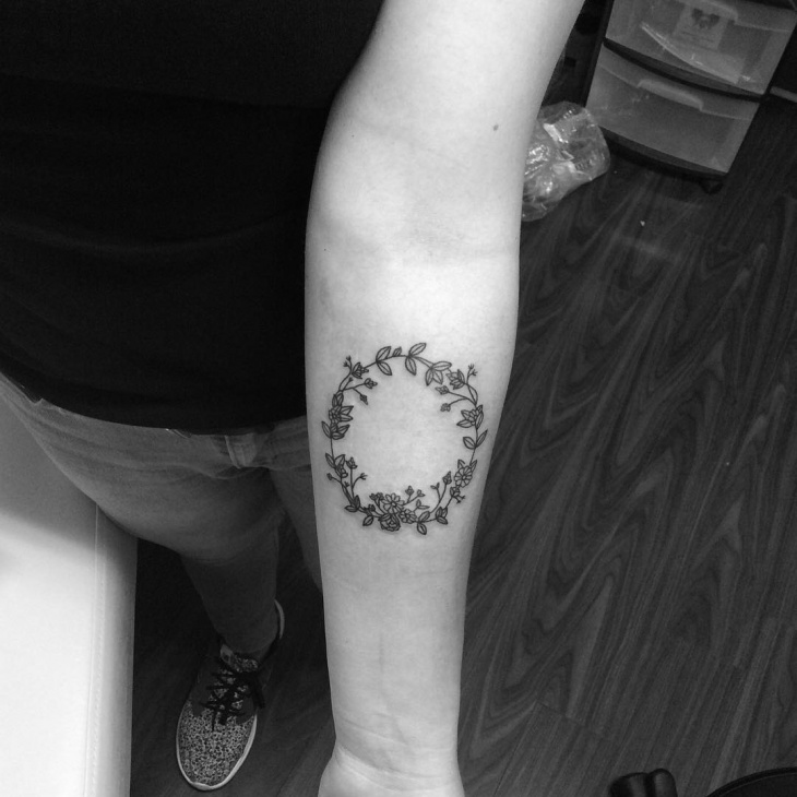 daisy wreath tattoo