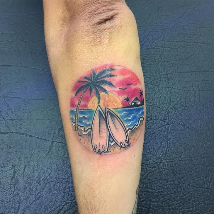 beach tattoo on elbow
