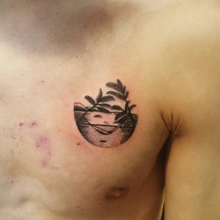 black beach tattoo on chest