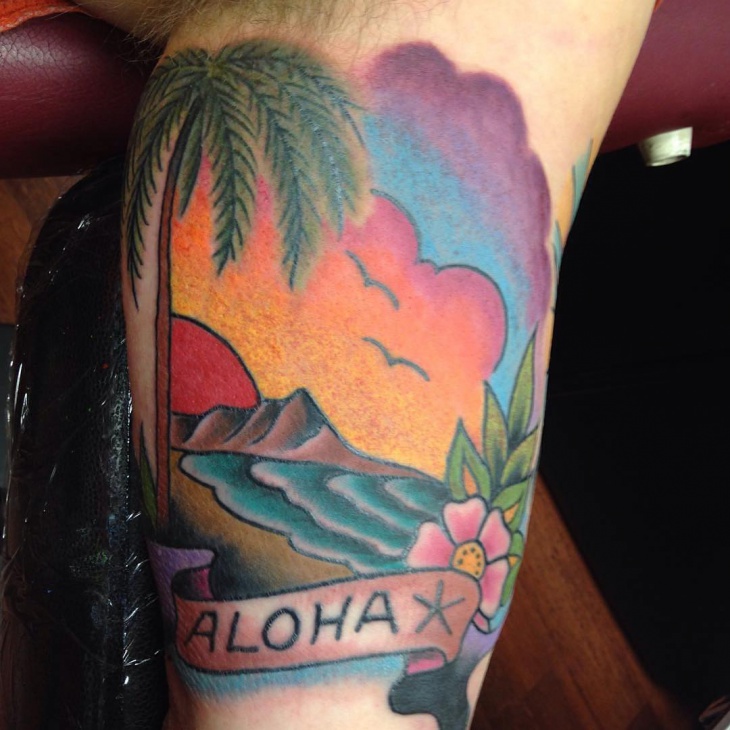 colorful beach tattoo on knee