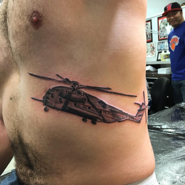 helicopter stomach tattoo