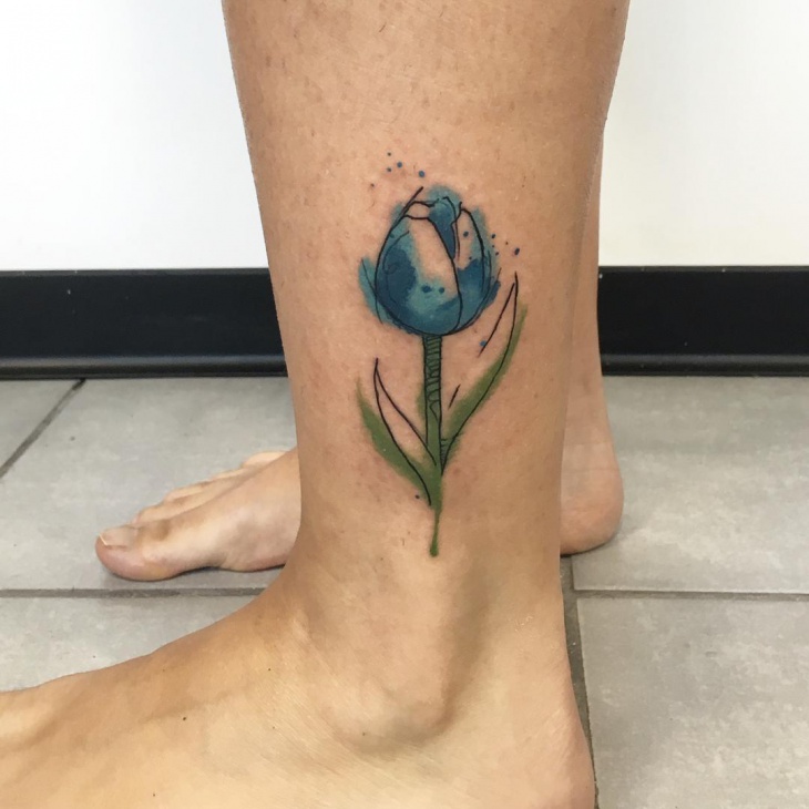 blue and green sketch tattoo