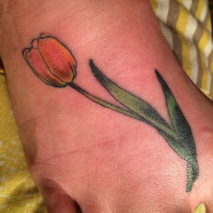 simple tulip tattoo on foot