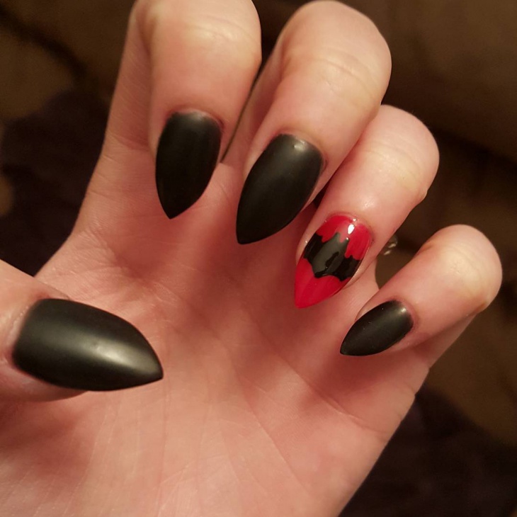 red and black bat nail art