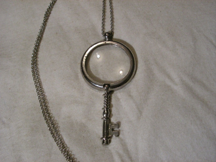 key magnifying glass pendant