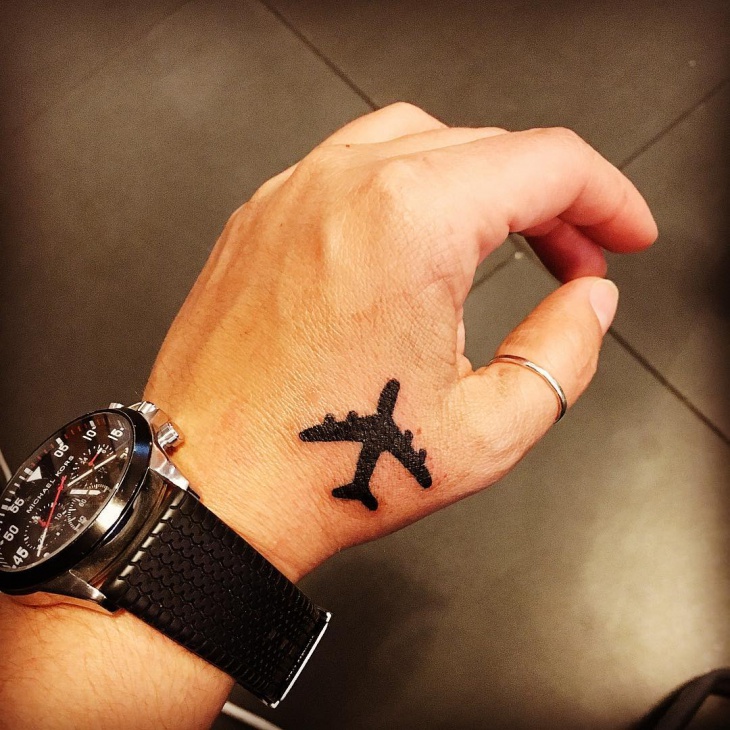 black work airplane tattoo