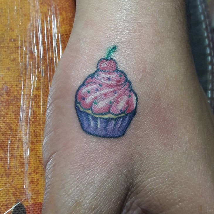 little cupcake tattoo on palm