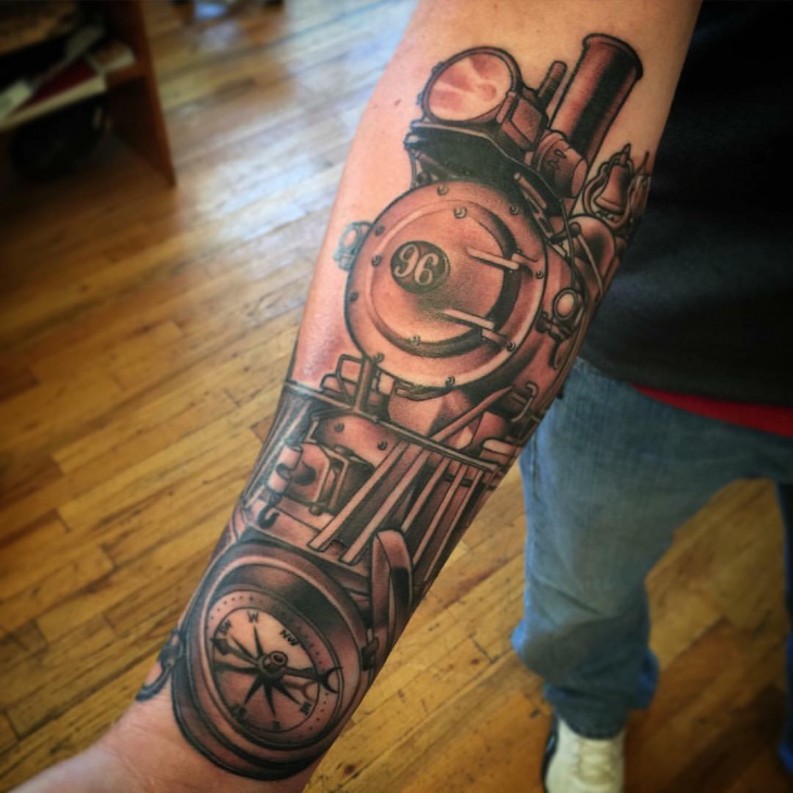 train tattoo on forearm