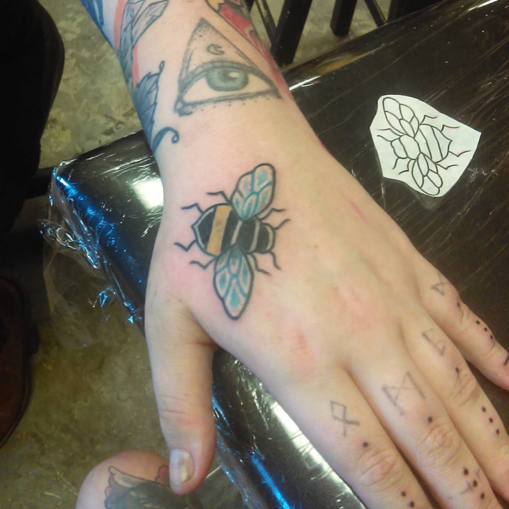 bumble bee tattoo on palm