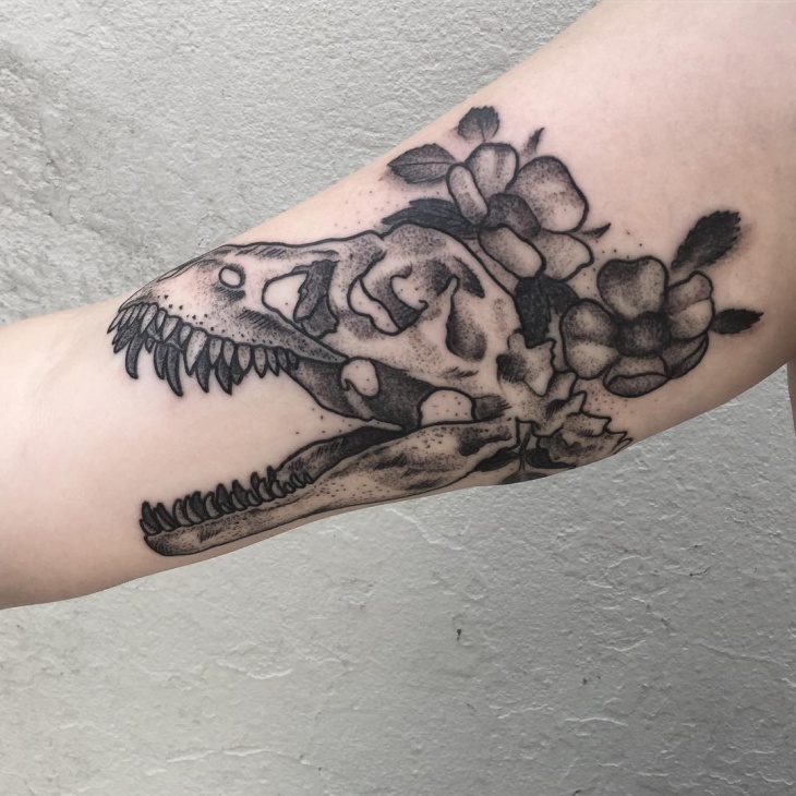 blackwork dinosaur tattoo