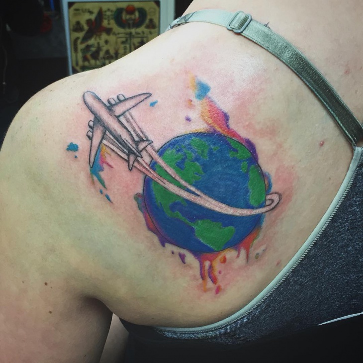 earth tattoo on shoulder