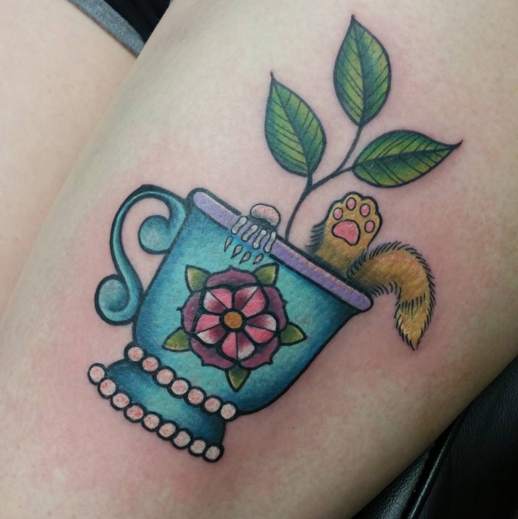 teacup tattoo on thigh