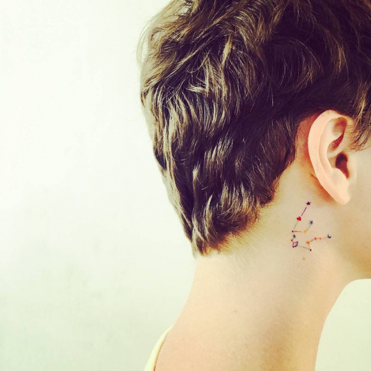 constellation behind ear tattoo