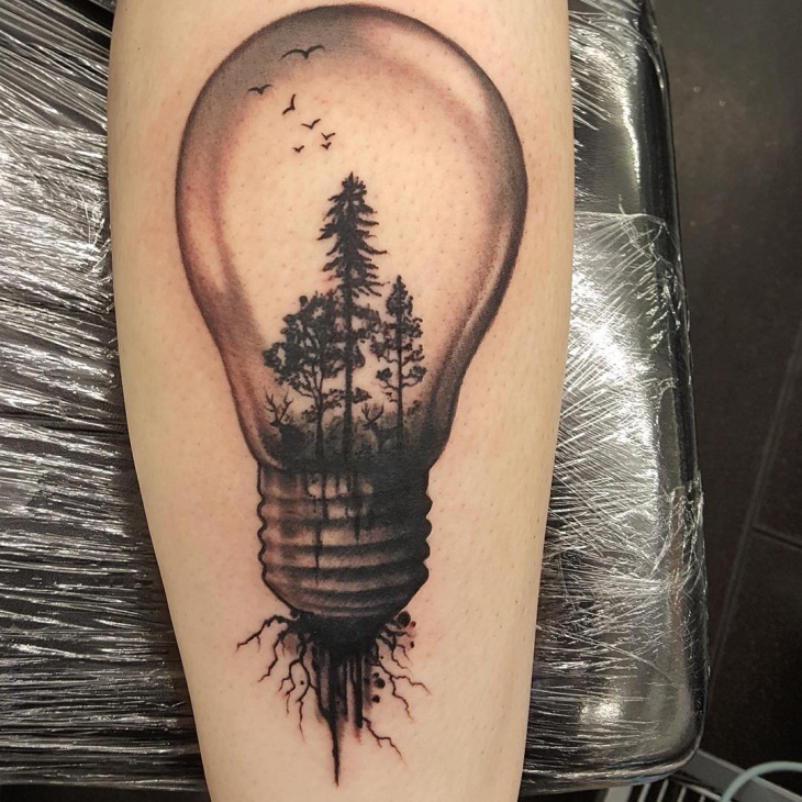 blackwork light bulb tattoo