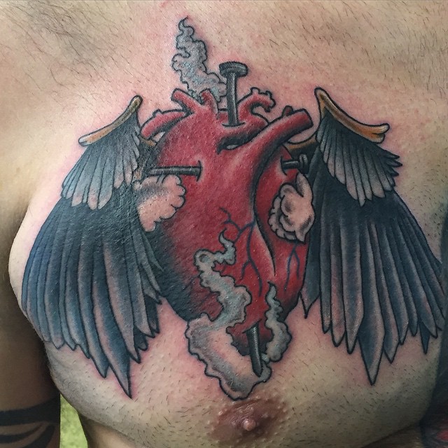 sacred heart with wings tattoo