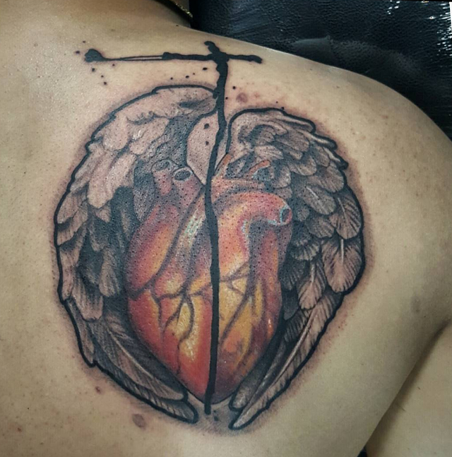 broken heart with wings tattoo