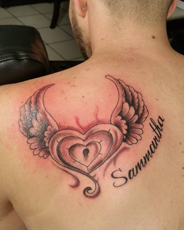 simple heart with wings tattoo