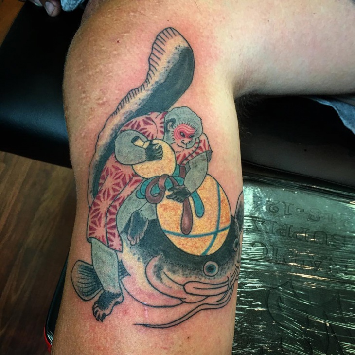 color catfish tattoo on leg