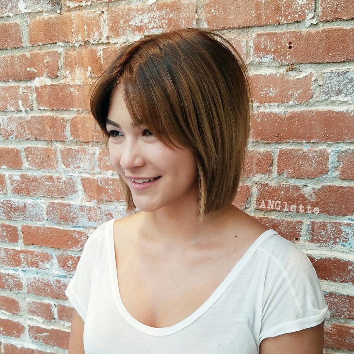 center parted short hairstyle for long face