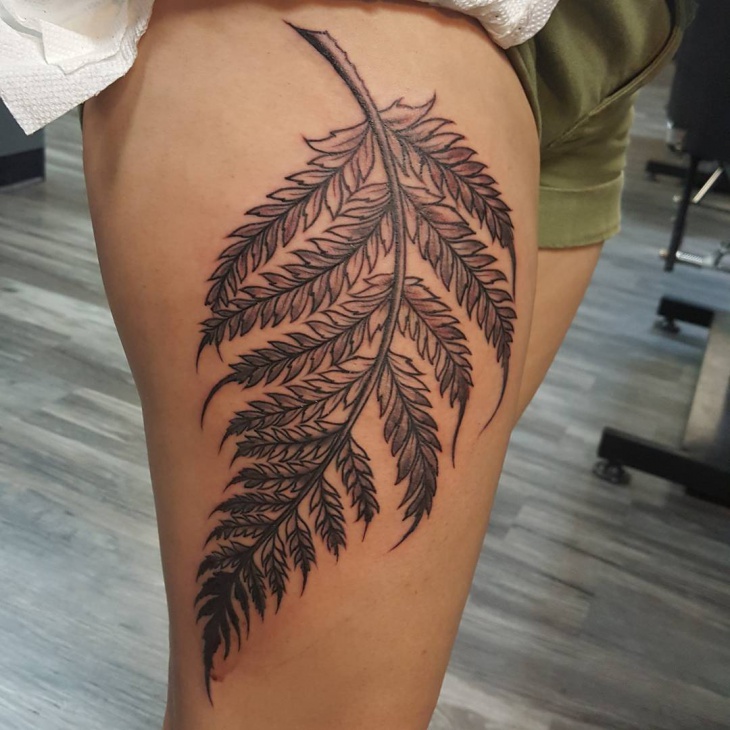 fern tattoo on thigh