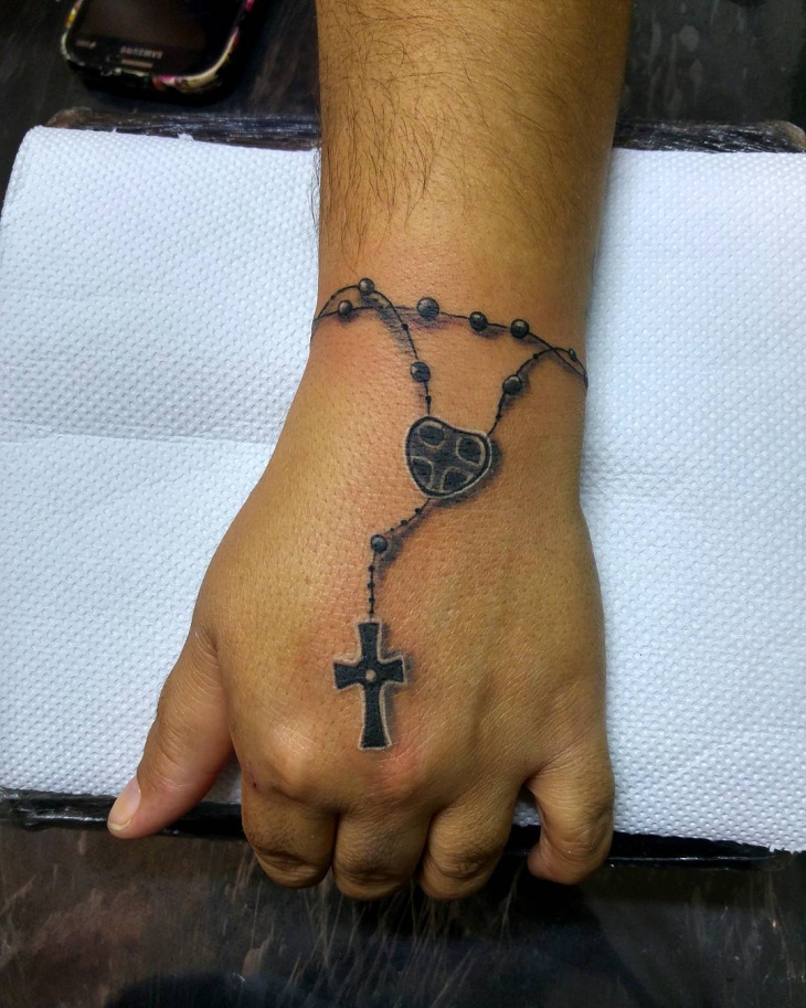 black and gray cross tattoo