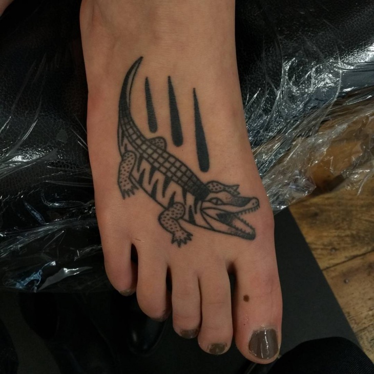 crocodile tattoo on foot