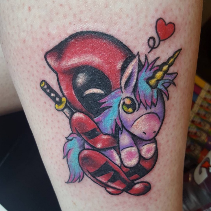 deadpool with unicorn tattoo