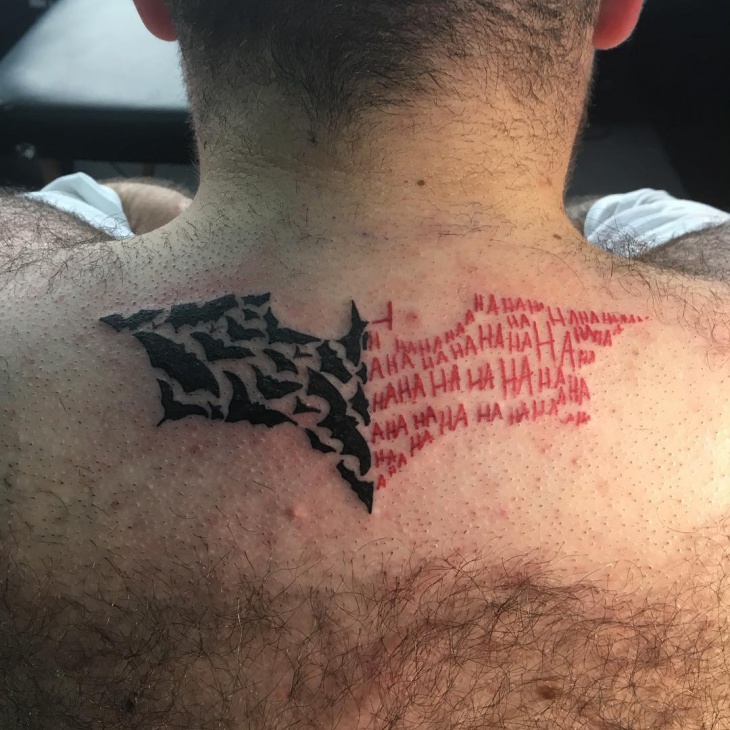 batman tattoo on bellow neck