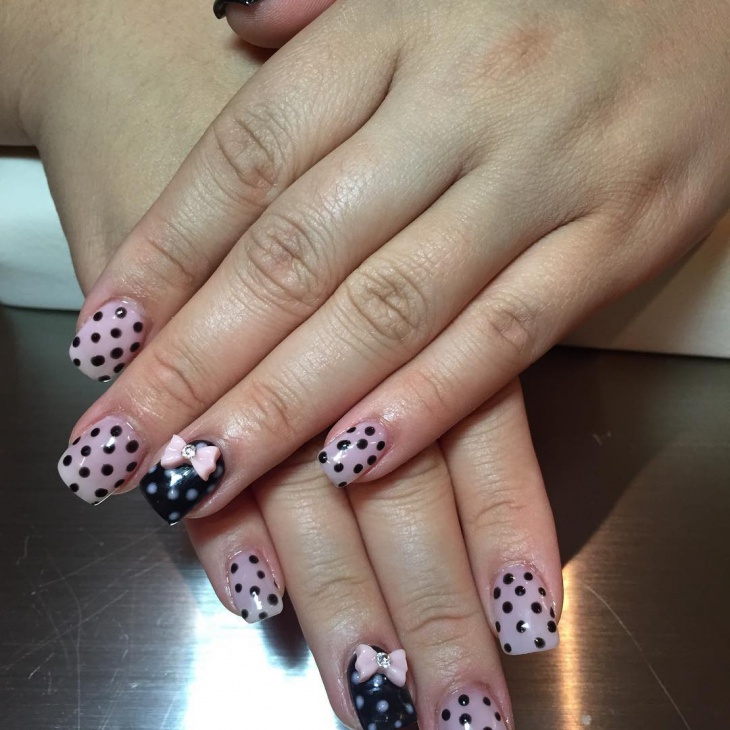 polka dot and bow nail design