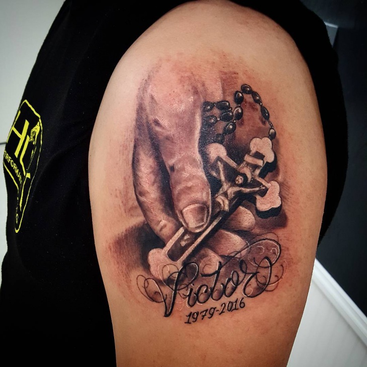 hand cross tattoo on sleeve