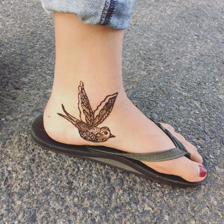 bird henna tattoo design on foot