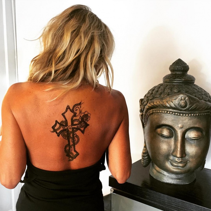 henna cross tattoo on back