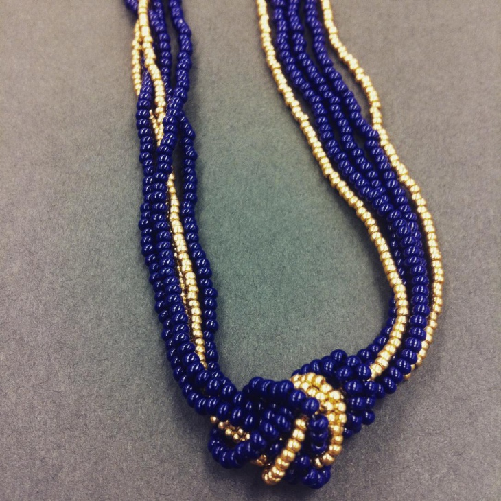 blue and gold beaded knot necklace