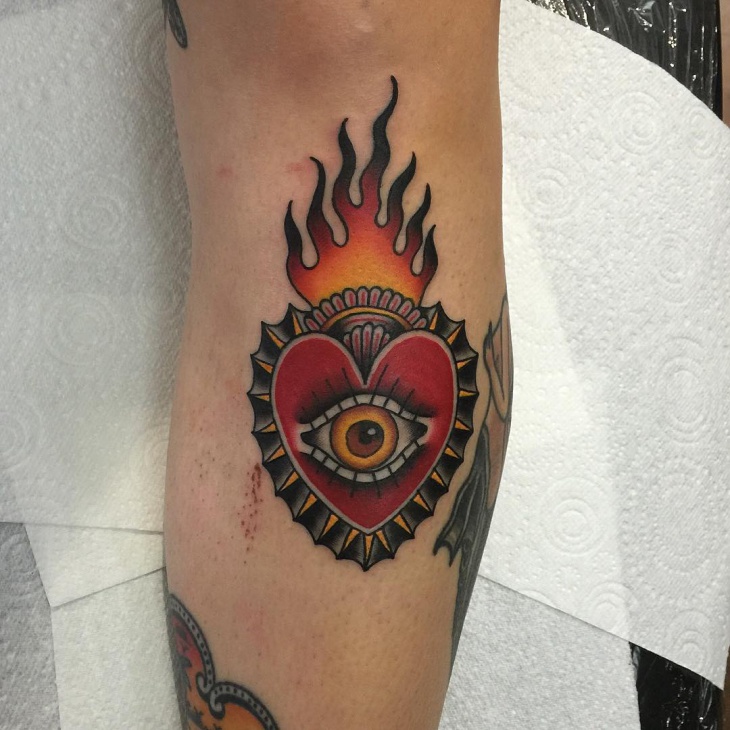 scared eye with heart tattoo