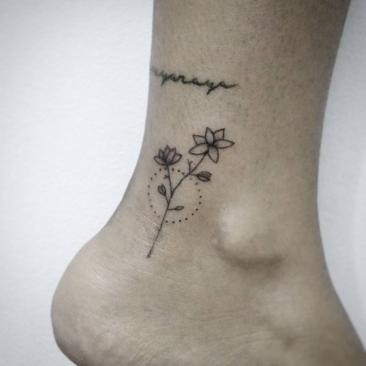 small flower tattoo design on ankle